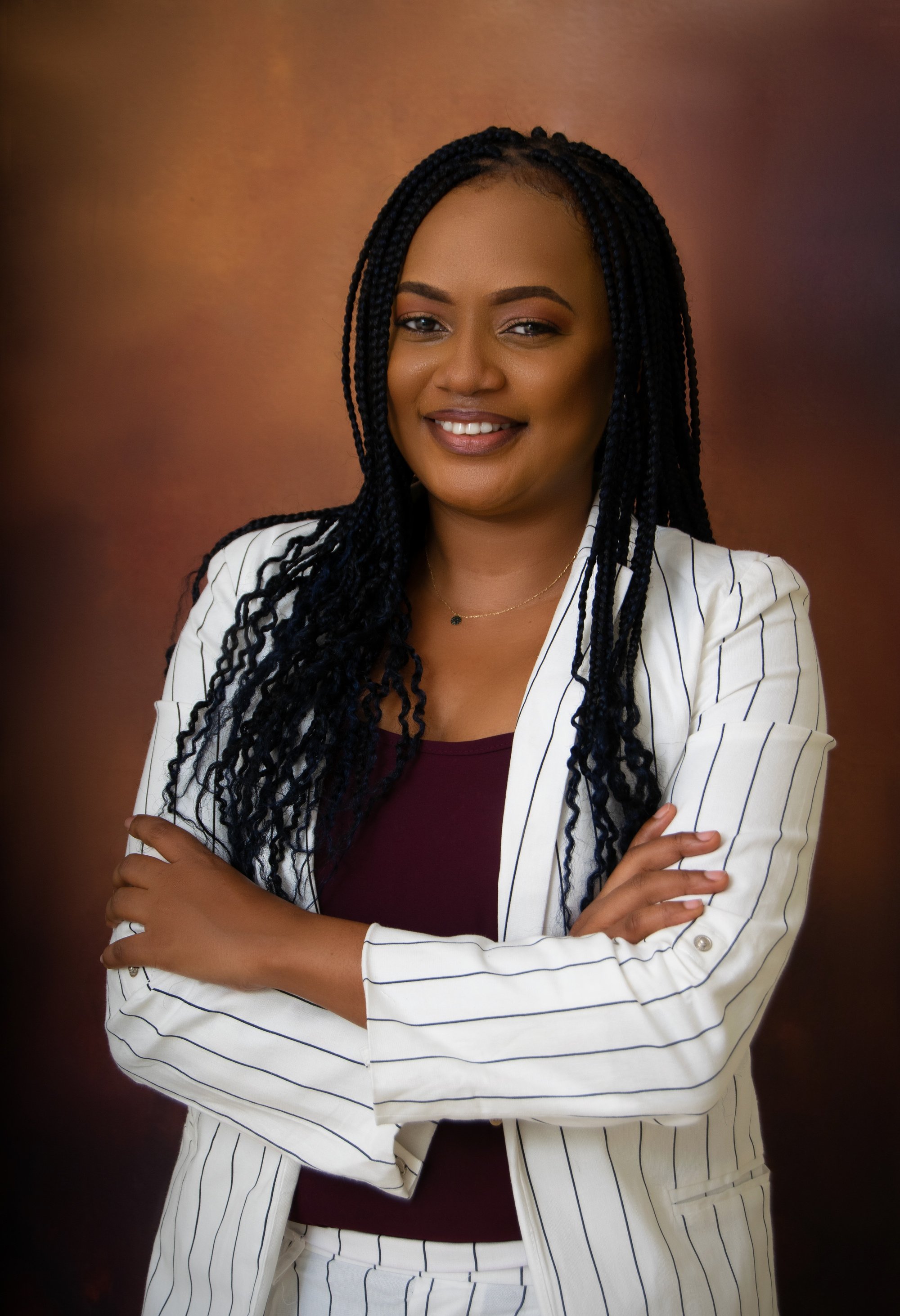 Cheerful black woman with hands crossed